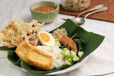 Nasi pecel. traditional javanese rice dish of steamed rice with vegetable salad, 