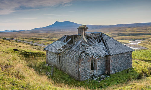 Built structure on land against sky