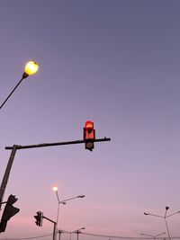 Low angle view of street light against sky