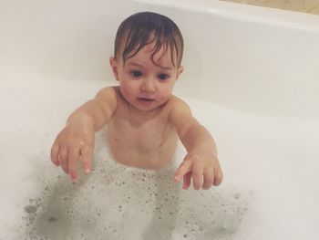 Cute baby boy in bathroom