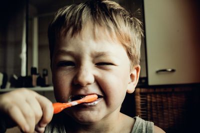 Boy brushing his teeth