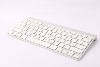 Close-up of computer keyboard against white background