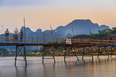 Scenic view of river against sky during sunset