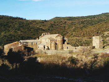 Old ruins on mountain against sky