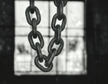 Close-up of padlock on metal gate