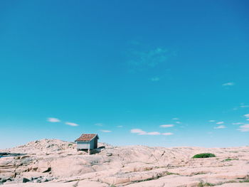 Hut on rock formation at tjurpannans naturreservat against sky