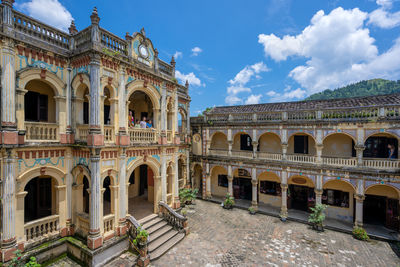 Historic building against cloudy sky