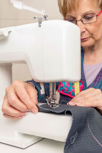 Midsection of woman using smart phone