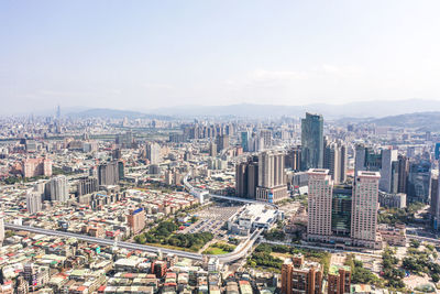 High angle view of modern buildings in city against sky