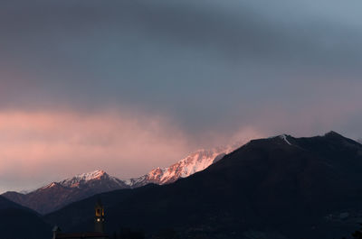 Scenic view of snowcapped mountains against sky during sunset