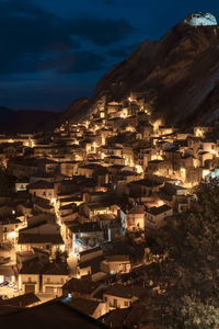 High angle shot of townscape against sky at night