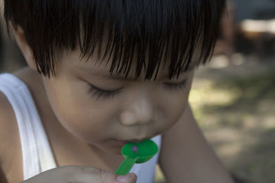 Close-up of boy holding ice cream