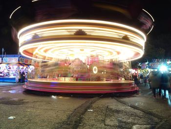 Blurred motion of people in city at night