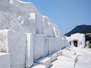 Low angle view of marble structure against clear blue sky