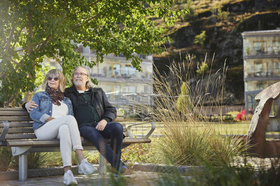 Mature couple relaxing on bench