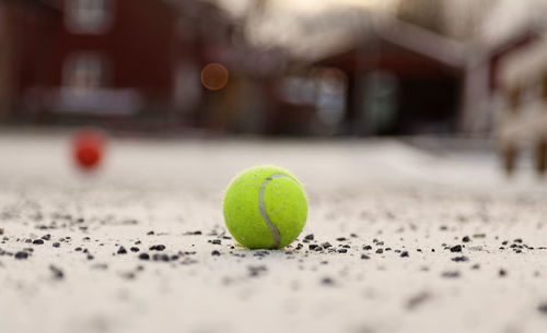 Close-up of green ball on bed