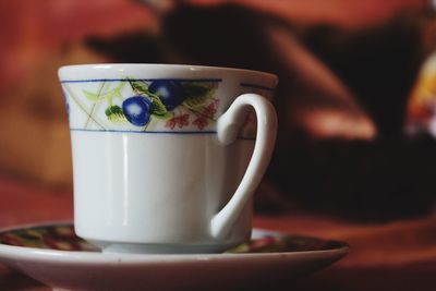 Close-up of tea cup on table