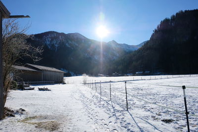 Scenic view of snow covered mountains against sky