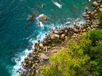 High angle view of rocks on sea