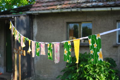 Colorful fabrics hanging against house