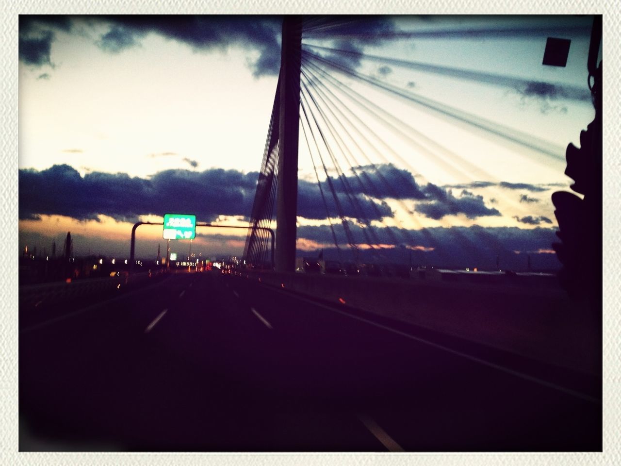 transportation, transfer print, sky, road, auto post production filter, car, mode of transport, road marking, cloud - sky, land vehicle, sunset, the way forward, travel, street, on the move, highway, city, diminishing perspective, cloud, built structure