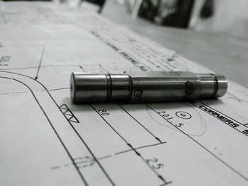 Close-up of pen on book