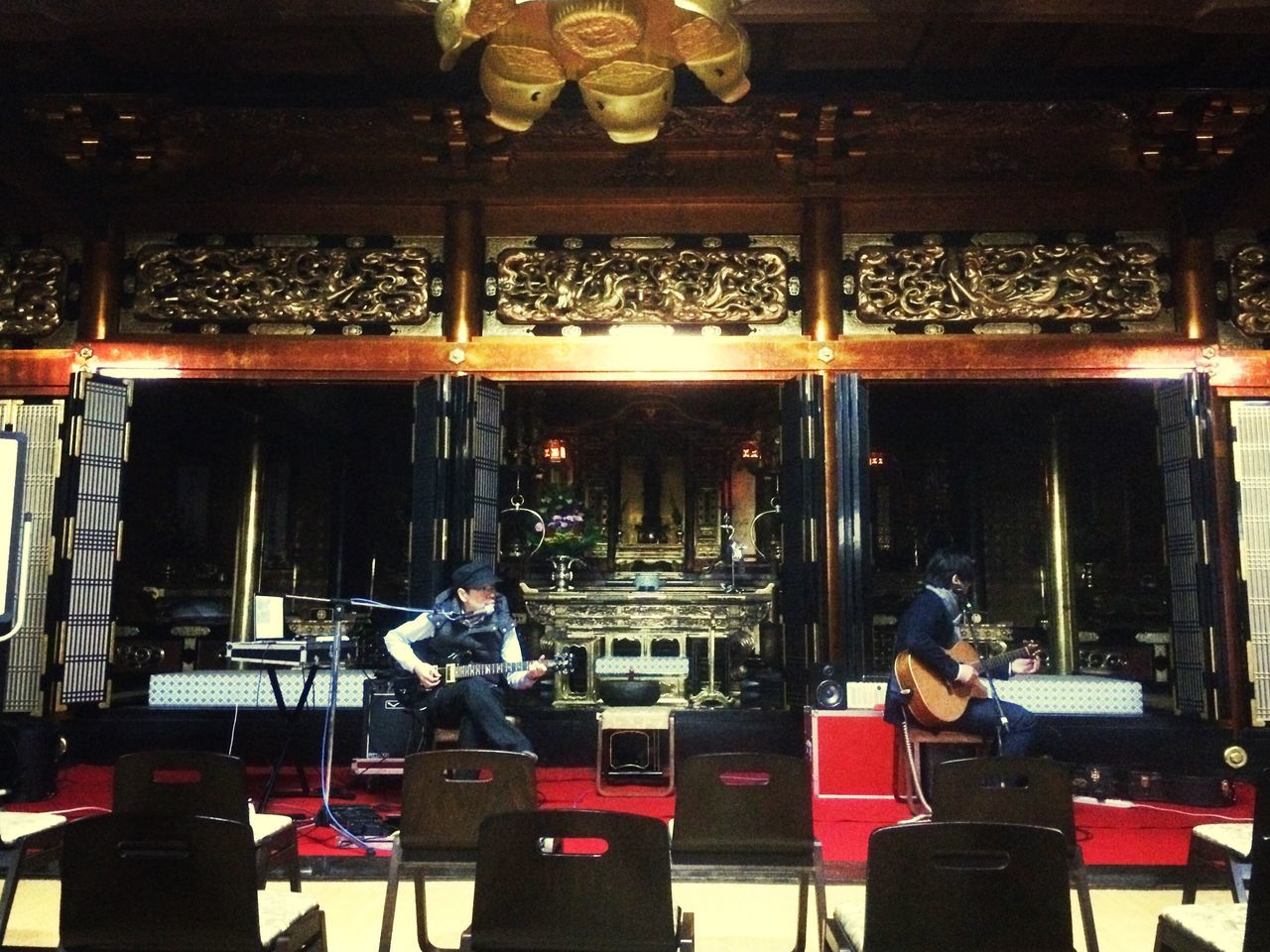 indoors, sitting, men, lifestyles, leisure activity, working, occupation, casual clothing, rear view, standing, technology, night, holding, table, person, reflection