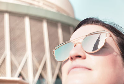 Close-up portrait of woman wearing sunglasses