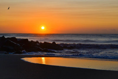 Scenic view of sea against sky during sunset
