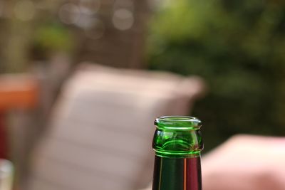 Close-up of beer glass bottle on table