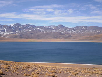 Scenic view of mountains against cloudy sky