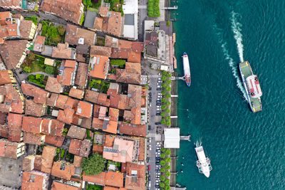 High angle view of buildings by sea