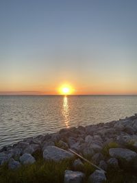 Scenic view of sea against sky during sunset