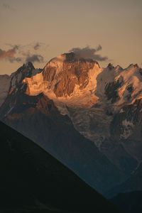 Scenic view of mountain range against sky during sunset