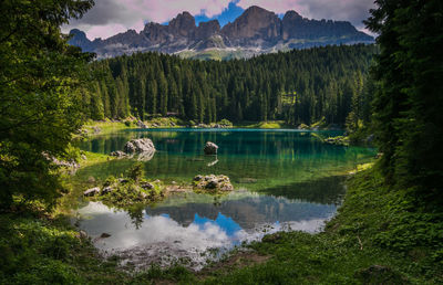 Scenic view of lake and mountains against sky