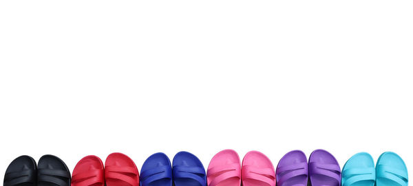 Low section of people against white background