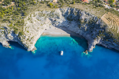 High angle view of rock formation in sea