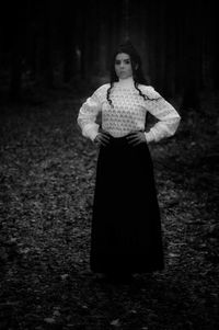 Portrait of woman standing on field