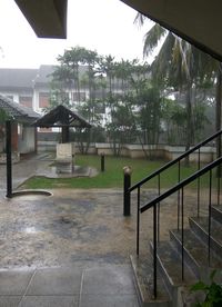 Built structure by trees against sky