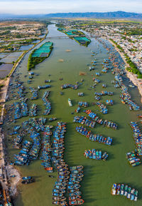 High angle view of city lit up at beach