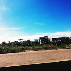 Road with buildings in background