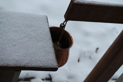 Close-up of snow on rusty metal during winter