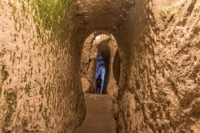 Rear view of man in tunnel