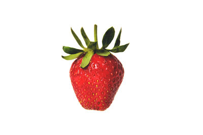 Close-up of strawberry over white background