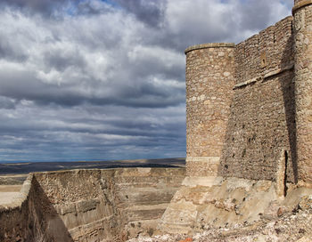 View of castle against cloudy sky