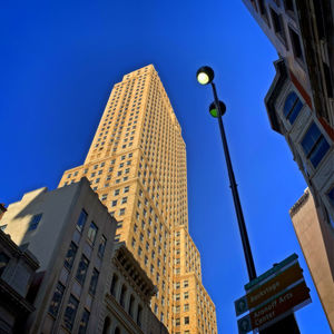 Low angle view of modern building against clear blue sky