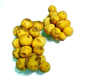 Close-up of fruits against white background