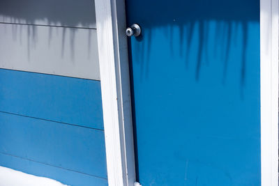 Close-up of blue window on wall of building