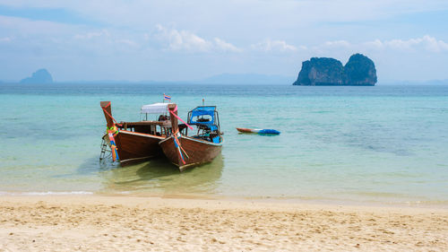 Boat in sea against sky