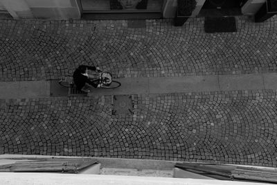 High angle view of man walking on street